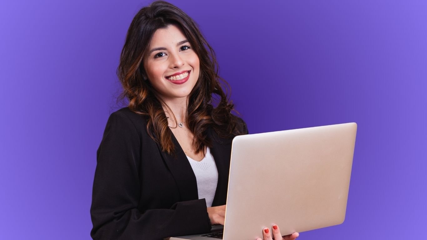 Small business owner analyzing SEO growth report on a laptop with upward graph